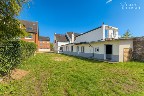 Seitenansicht - Einfamilienhaus mit 100,00 m² in Neuss zum Kaufen