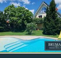 BRUMANI | Modernes Einfamilienhaus mit hochwertigem Anbau, Doppelgarage und Pool in Buggingen
