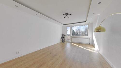 Wohnzimmer - Gut geschnittene 3-Zimmer-Eigentumswohnung mit Balkon und Garage an der Weser