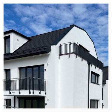 Außenansicht - 2,5-Zimmer-Dachgeschosswohnung mit Teilmöblierung