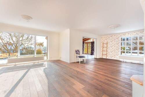 Wohn- und Esszimmer mit Zugang zum Wintergarten - 