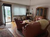 Wohnzimmer mit Zugang zum Wintergarten - 