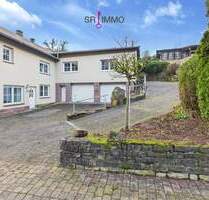 Wohnen mit Perspektive: Haus mit zwei Wohnungen und Baugrundstück in Baustert