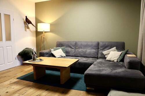 Wohnzimmer - Doppelhaushälfte mit 102,00 m&sup2; in Großefehn zum Kaufen