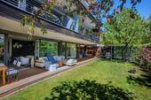 Gartenfassade - Komfortable Erdgeschosswohnung mit Einliegerbereich in ruhiger Lage