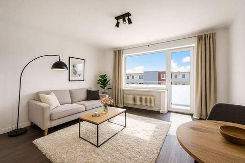 Wohnzimmer_a_gestaged - 2 Zimmer Etagenwohnung in Elmshorn