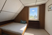 Schlafzimmer mit grandiosem Ausblick auf den Deich - 