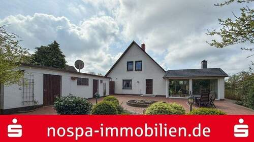 Rückansicht - Top gepflegt! Teilunterkellertes Einfamilienhaus mit Wintergarten, Garage und Terrasse!