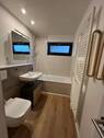 Wannenbad mit Fenster - 