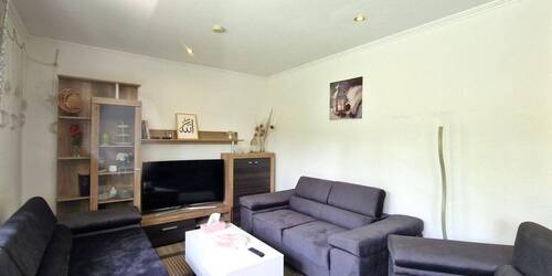 Wohnzimmer mit Blick in den Flur - 