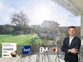 Titelbild - Erdgeschosswohnung mit Garten & zusätzlicher Gewerbeeinheit - vielseitig nutzbar