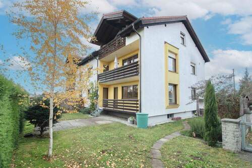 Objektansicht - Gepflegte 3-Zi. Hochparterre Wohnung mit eigenem Garten, Einzelgarage und Außenstellplatz