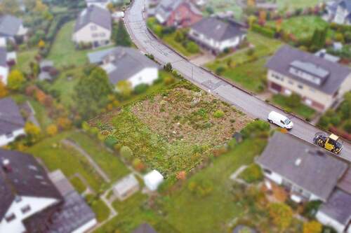 Luftaufnahme Rückansicht links - Baugrundstück in gewachsener Wohnsiedlung