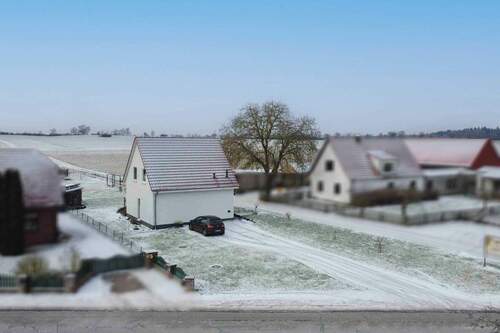 Ansicht Straßenseite (Nordost) - Einfamilienhaus mit 100,00 m&sup2; in Feldberger Seenlandschaft zum Kaufen