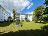 Hausansicht mit Garten - Terrassenwohnung mit 70,00 m&sup2; in Neu-Ulm zum Kaufen
