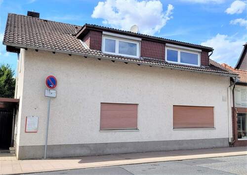Hausansicht - 5 Zimmer Mehrfamilienhaus, Wohnhaus zum Kaufen in Echzell