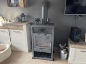 Wasserführender Ofen im Wohnzimmer EG - 