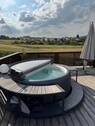 Terrasse mit Whirlpool - Großzügiges Zweifamilienhaus mit unverbaubarem Weitblick in Wipfeld