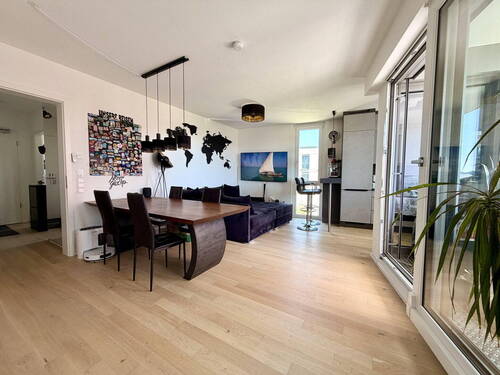 Wohnzimmer - 3-Zimmer-Wohnung im 'WAVE' mit Loggia, zwei Bädern und E-Stellplatz