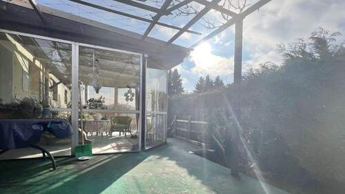 Terrasse mit Zugang zum Wintergarten - 