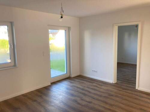 Heller Wohnbereich im EG mit Zugang zur Terrasse, Ansicht I - 