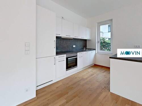 Blick in die offene Küche mit Kücheninsel - 