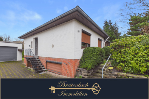 Breitenbach • Immobilien - Achim . Ein Zuhause mit besonderem Highlight, Einfamilienhaus mit Wintergarten, Kamin & Indoor Pool