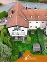 Luftaufnahme - Eigentumswohnung zur späteren Eigennutzung mit eigenem Garten im Zweifamilienhaus