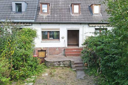 Rückseite des Hauses mit geschützter Terrasse - 