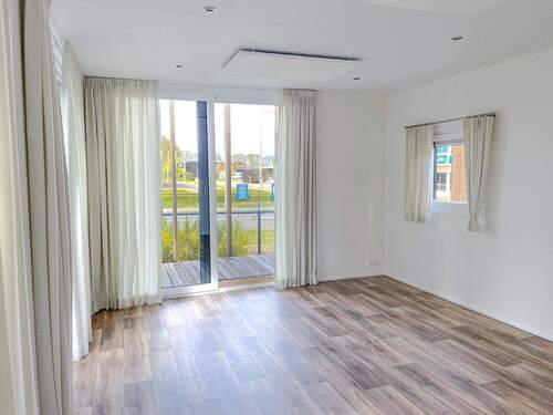 Wohnbereich mit Ausgang zur Terrasse - 