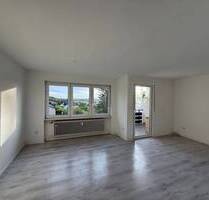Provisionsfrei & bezugsfähig! Nette 3-Zimmer-Wohnung mit Südwestloggia, ca. 77,6 qm im 1.OG in ruhiger Hanglage - Dietersheim