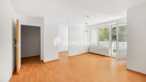 Wohnzimmer 1 - Erdgeschosswohnung mit Terrasse und klarer Raumstruktur