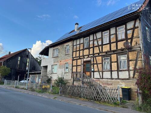 Frontansicht Haus - 1 Zimmer Einfamilienhaus zum Kaufen in Hildburghausen