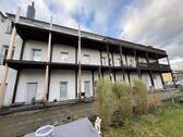 Gebäudeansicht - Investmentchance: Mehrfamilienhaus mit 14 Einheiten & Wohngrundstück für Neubau bei Leverkusen