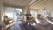 Großer Wohnbereich mit Kamin und Zugang Garten - Terrasse - 5 Zimmer Bungalow zum Kaufen in Salem