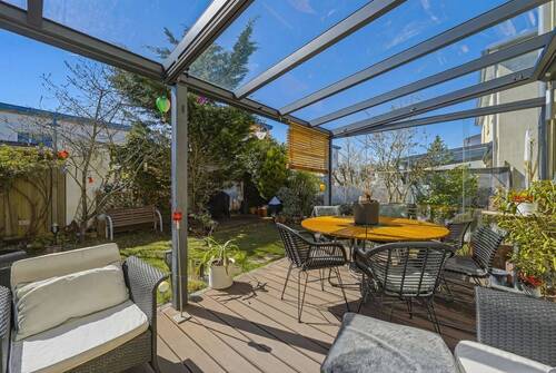 Mit Glas überdachte Terrasse - 