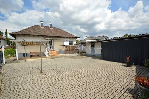 Außenansicht mit Sonnengrundstück - Einfamilienhaus mit 74,00 m² in Nieder-Hilbersheim zum Kaufen
