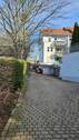 Ansicht mit Einfahrt Tiefgarage - 2 Zimmer Terrassenwohnung zum Kaufen in Hartmannsdorf