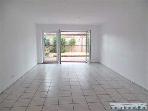 Wohnung 1 - Wohnzimmer mit Terrassenzugang (Archivbild/ Wohnung 2 spiegelbildlich) - 