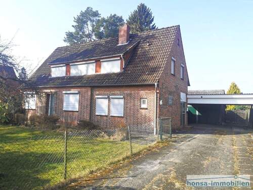Ansicht von der Straße mit Carport (Nord-Ost) - Einfamilienhaus mit 135,00 m&sup2; in Lauenbrück zum Kaufen