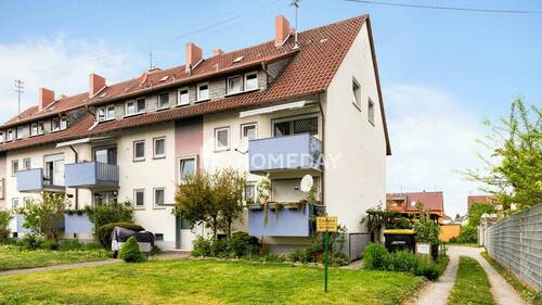 Außenansicht 2 - Großzügiges Wohnen: Fünf-Zimmer-Wohnung mit zwei Balkonen, Gartenanteil und Carport