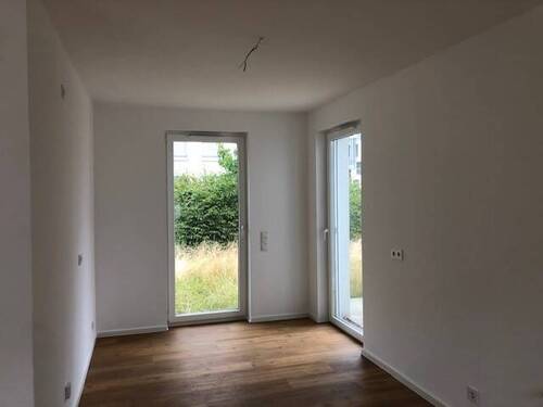 Nelkenweg 13c EG_Zimmer.jpg - 
