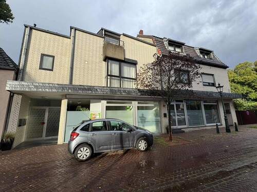 Vorderansicht - Großzügiges Invest, ETW mit vermietetem Ladenlokal in zentraler Lage