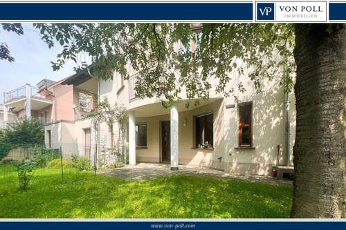 Garten - Urbaner Rückzugsort: großzügige Erdgeschosswohnung mit Garage nahe dem Zentrum