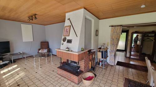 Wohnzimmer mit Kamin - Einfamilienhaus mit 125,00 m² in Herne zum Kaufen