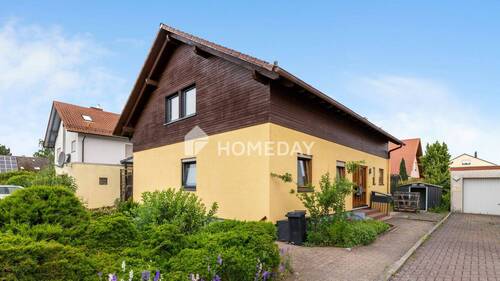 Außenansicht 2 - Teilvermietetes Mehrfamilienhaus mit Garten, Terrasse und Garage in begehrter Wohnlage