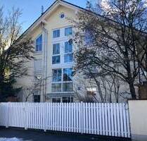 Großzügige Gartenwohnung über 2 Ebenen mit Wintergarten - München
