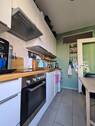 Küche mit Zugang zum Balkon - 