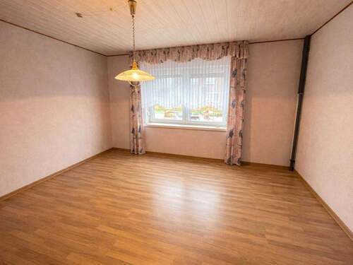 Schlafzimmer EG-Wohnung - Einfamilienhaus mit 152,70 m&sup2; in Schortens zum Kaufen