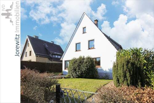 001 - Seitenansicht - Wohnen in Bi-Heepen: 4 Zimmer-Wohnung mit Terrasse und Gartennutzung